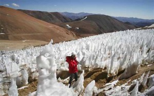 Man walks by El Toro II glacier on the Chilean side of the border district between Chiles Huasco province and Argentinas San Juan province